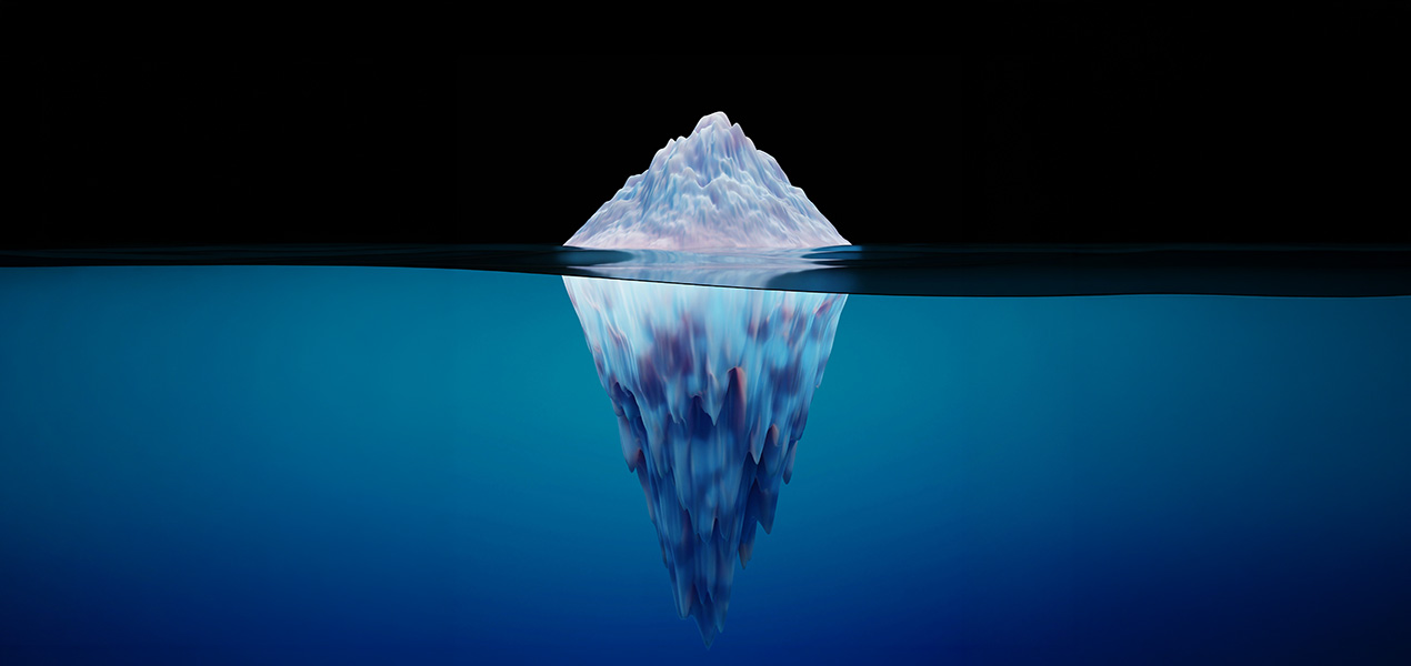 A cross-section view of an iceberg floating on the ocean.