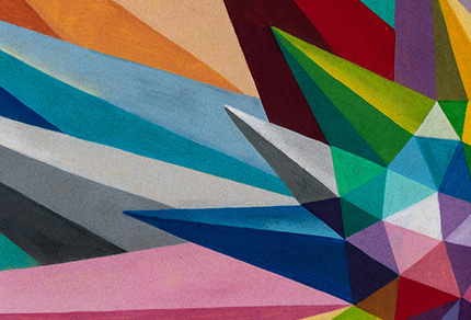 A brightly coloured set of geometric shapes forming points going in multiple directions.