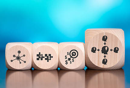 Wooden blocks with symbols of marketing concepts on blue background