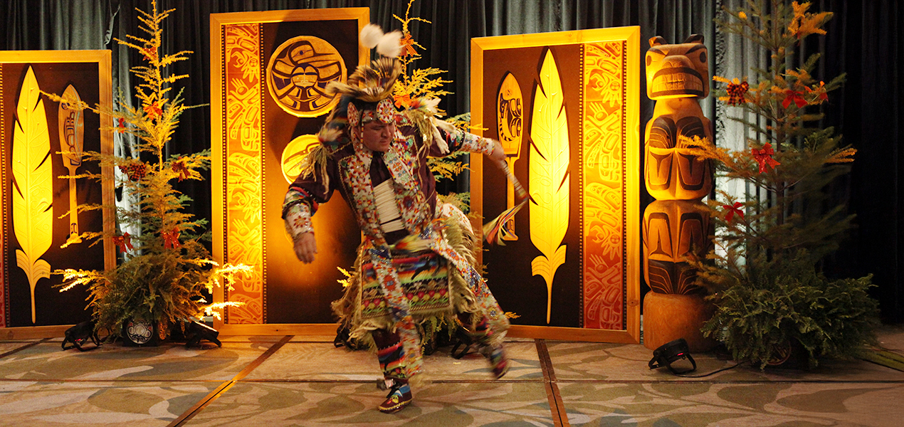 An Indigenous dancer performing at the ALF Holiday Banquet.