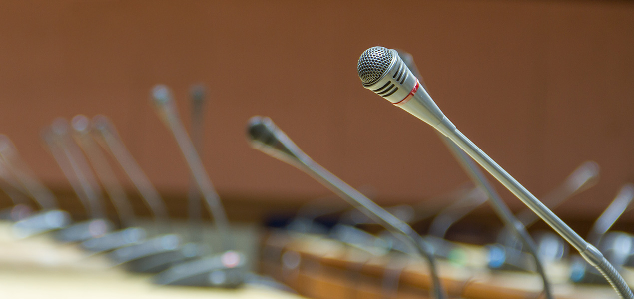 An empty panel of microphones.