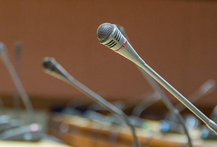 An empty panel of microphones.