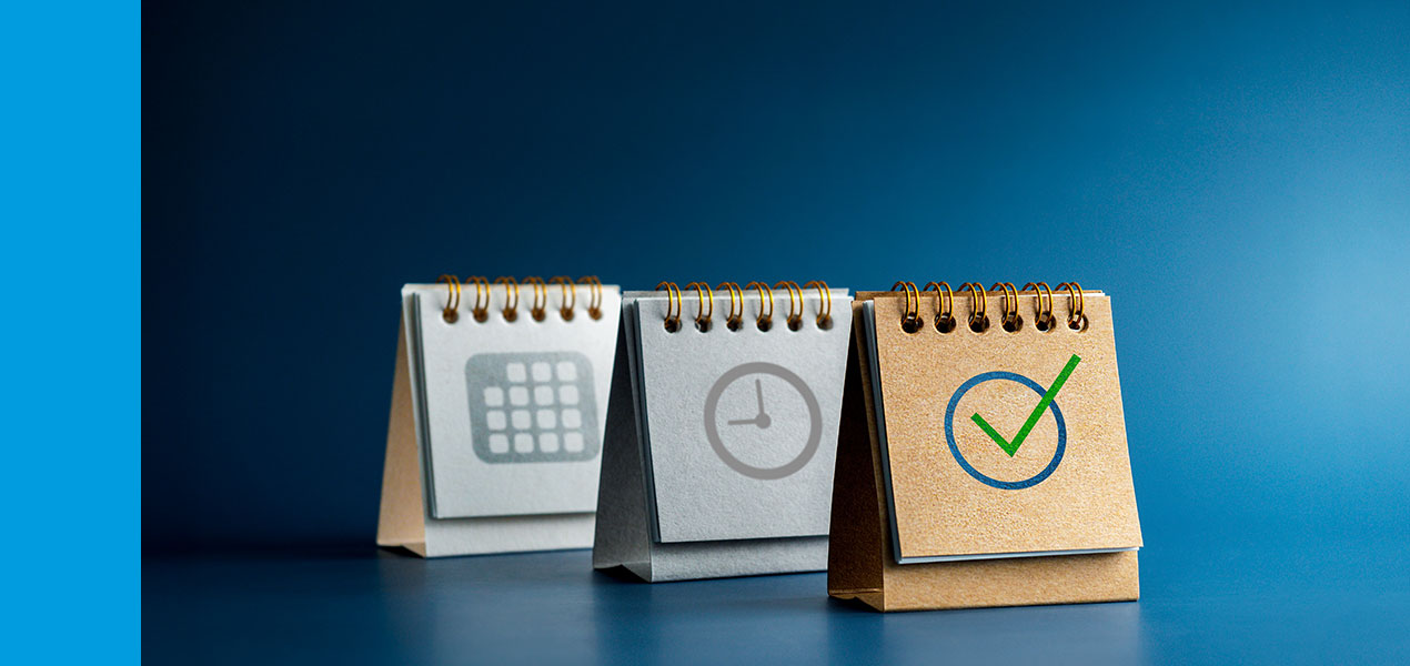 Three flip charts with a calendar, a clock and a checkmark.