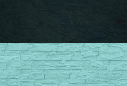 A dark block on top of a light blue brick wall. 