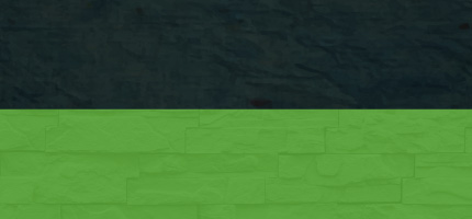 A dark block on top of a light blue brick wall. 
