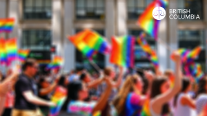 Parade of people holding pride flags