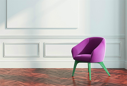 A empty chair in a beautiful room with hardwood flooring.