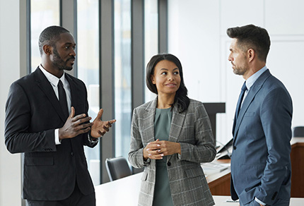 Three professionals having a discussion. 