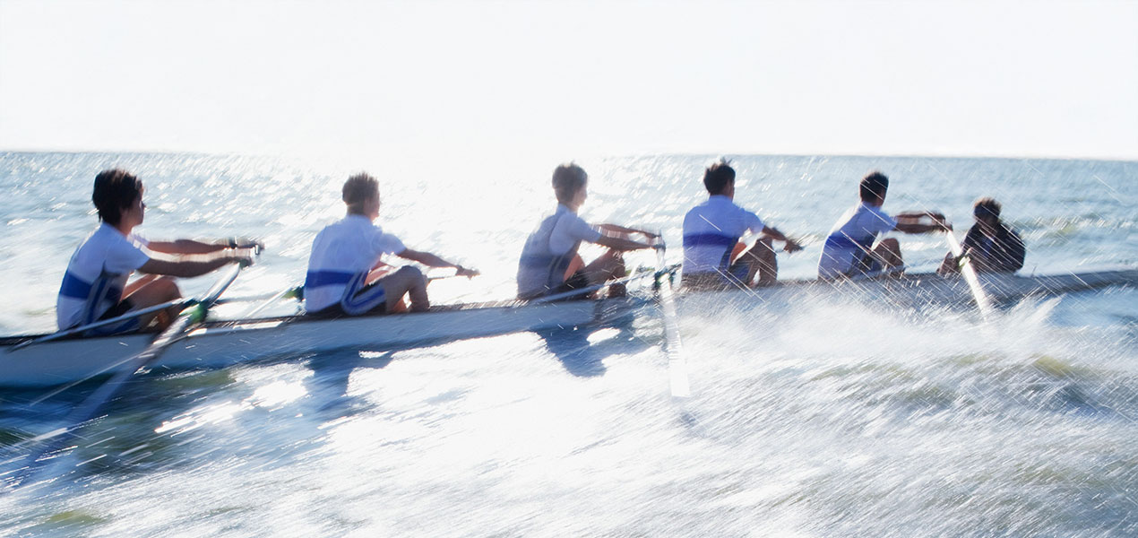 A rowing team working in unison. 