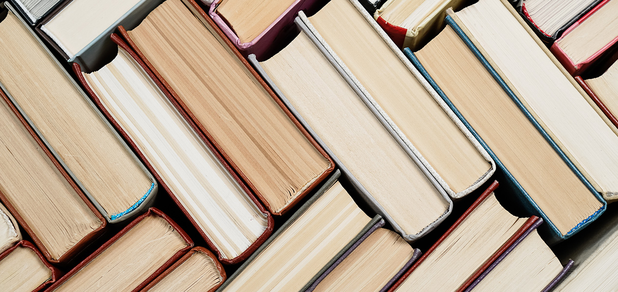 Books stacked in a chevron pattern.