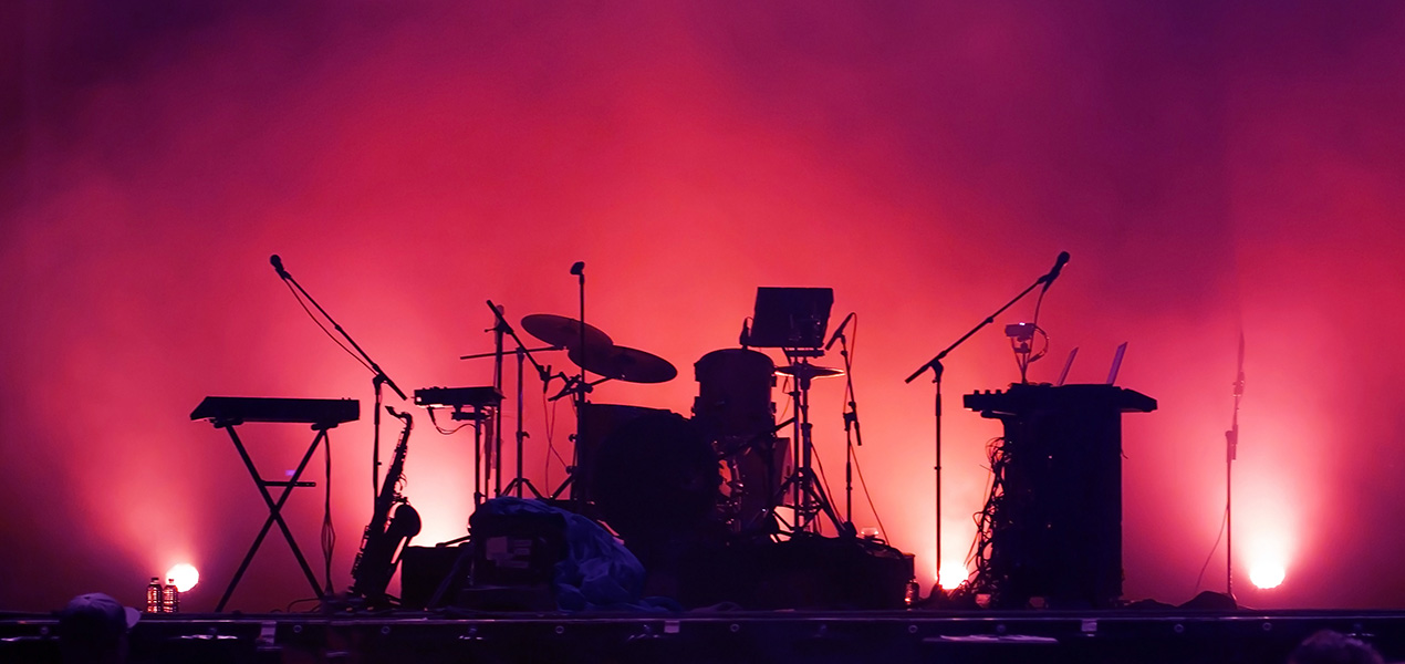 An empty stage with a full set of instruments.